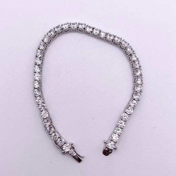 Silver Plated and Rhodium Tenis Bracelet with Cubic Zirconia Crystals 7” inches - Picture 4 of 5